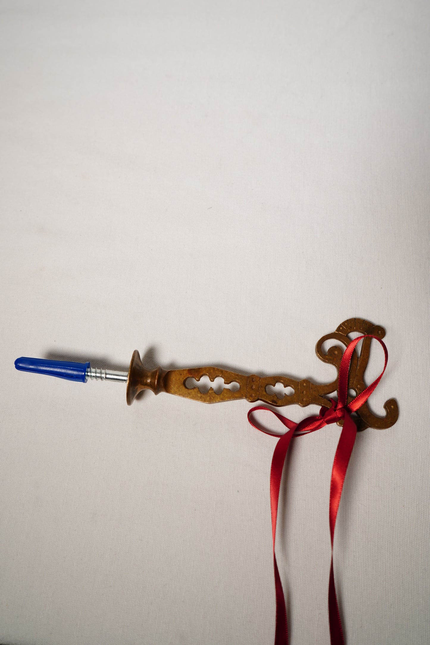 Pair of Ornate Brass French Curtain Rod Brackets with Scrollwork and Quatrefoil Piercing