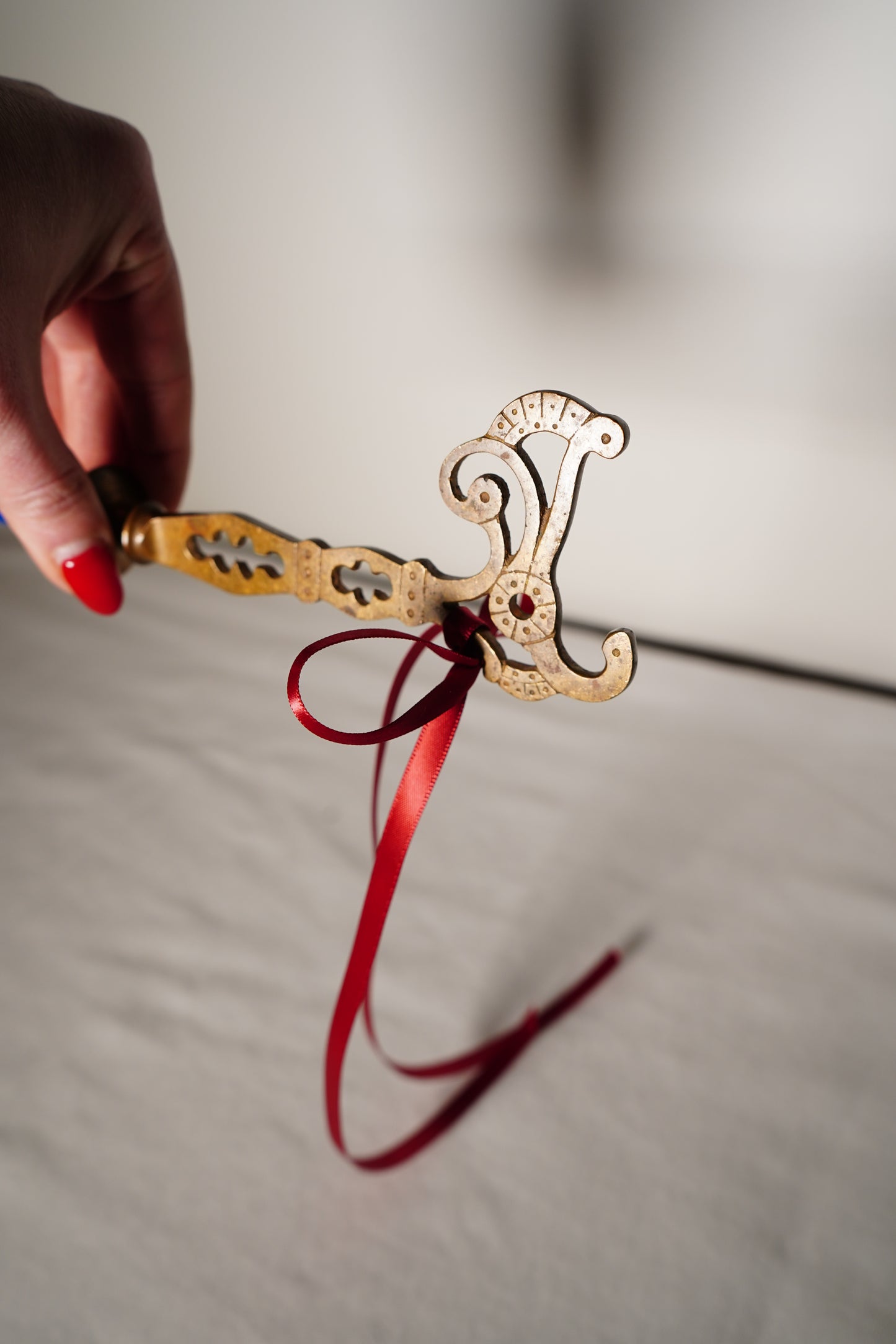 Pair of Ornate Brass French Curtain Rod Brackets with Scrollwork and Quatrefoil Piercing