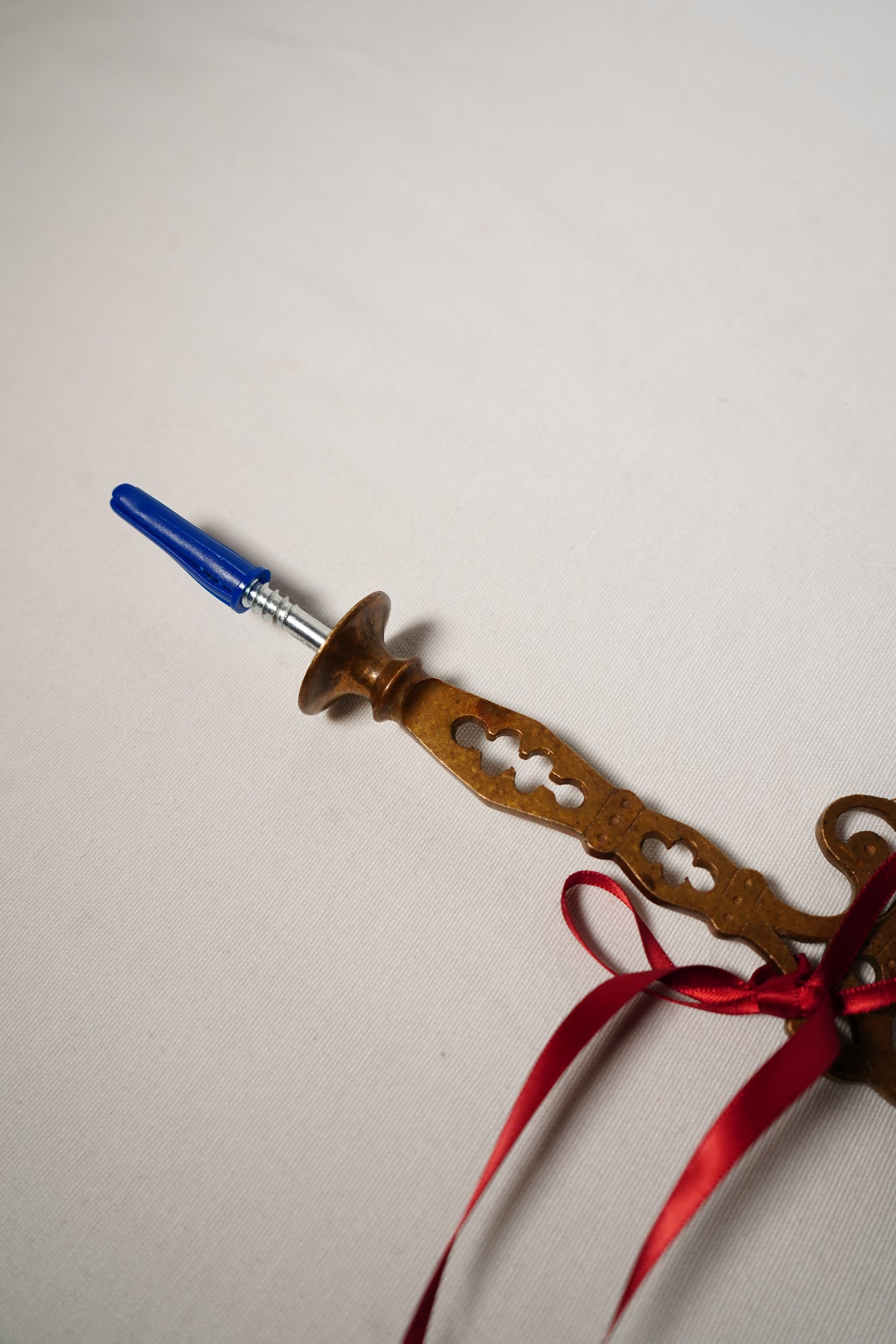 Pair of Ornate Brass French Curtain Rod Brackets with Scrollwork and Quatrefoil Piercing